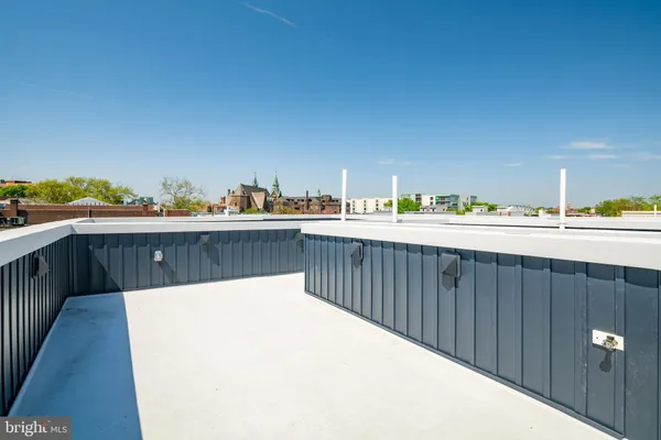 a balcony with a kitchen island