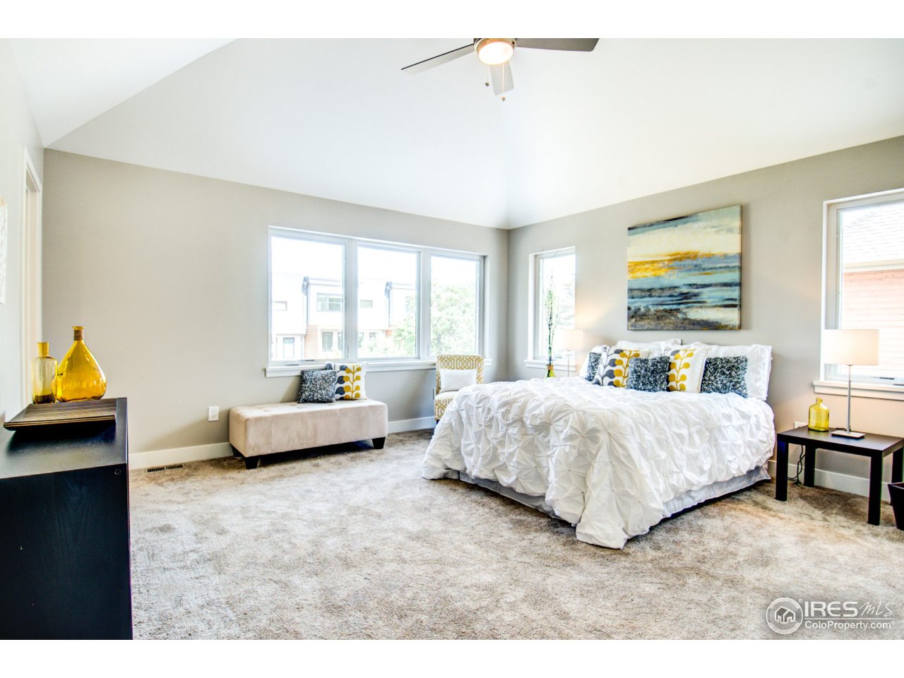 3959 Springleaf Lane Boulder, CO 80304 - Photo 12 of 25 a spacious bedroom with a bed and wooden floor