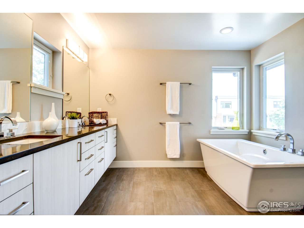 3959 Springleaf Lane Boulder, CO 80304 - Photo 13 of 25 a spacious bathroom with a double vanity sink a mirror and a bathtub