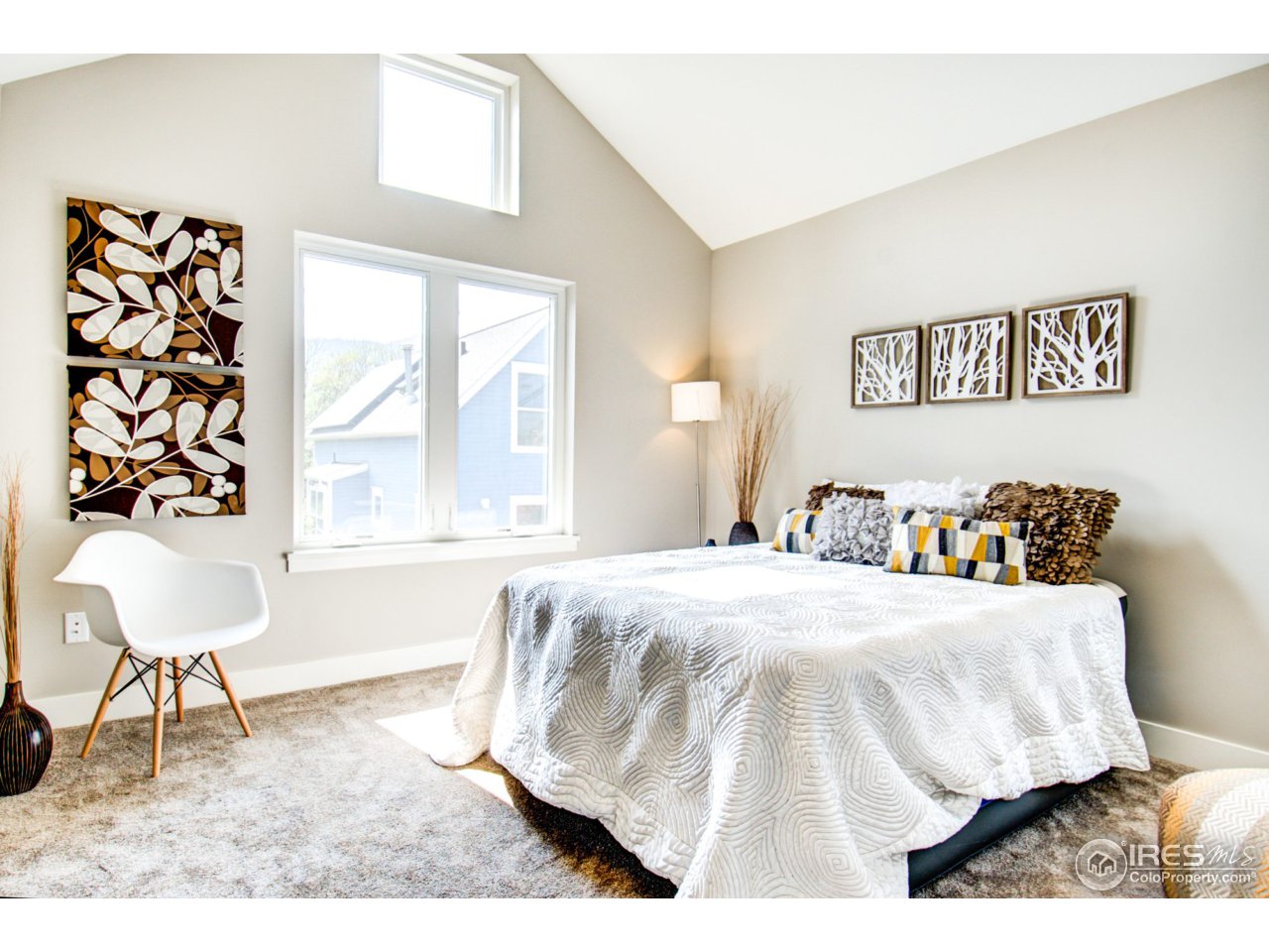 3959 Springleaf Lane Boulder, CO 80304 - Photo 17 of 25 a bedroom with a bed and a chair