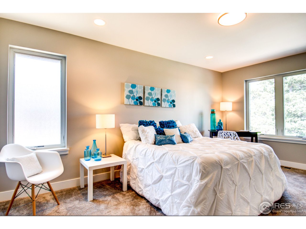 3959 Springleaf Lane Boulder, CO 80304 - Photo 19 of 25 a bedroom with a bed and a chair