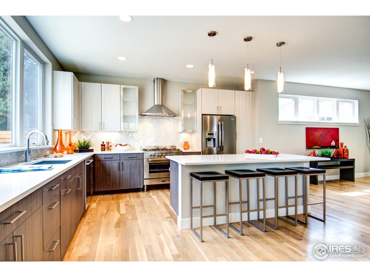 3959 Springleaf Lane Boulder, CO 80304 - Photo 10 of 25 a kitchen with stainless steel appliances kitchen island granite countertop a sink cabinets and wooden floor