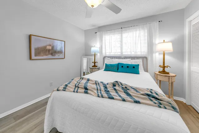 a bedroom with bed and a window