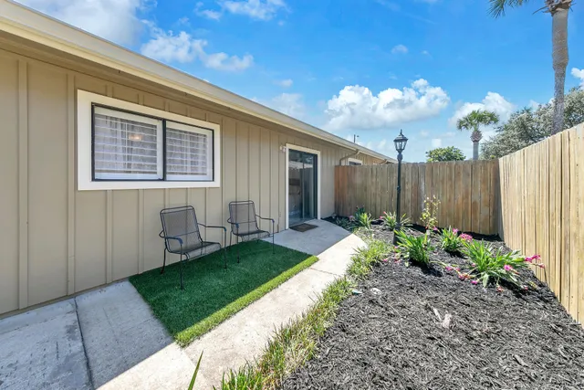 a view of a swimming pool with an outdoor seating