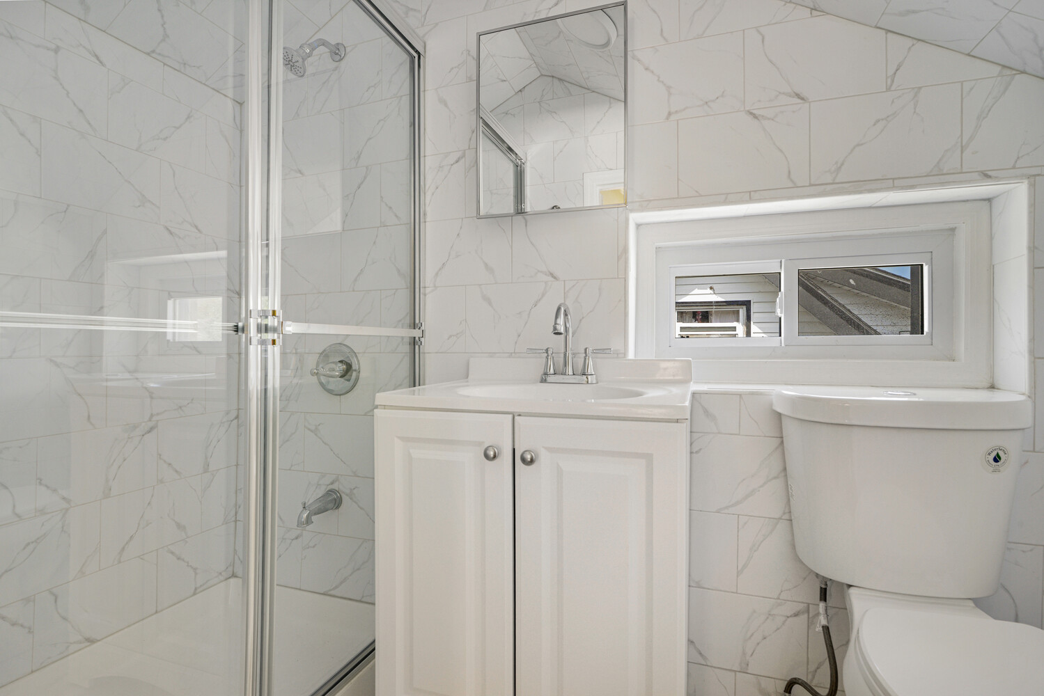 144-38 87th Avenue, Unit 2 Queens, NY 11435 - Photo 10 of 14 a bathroom with a sink a toilet and shower