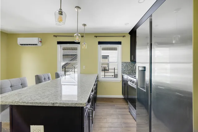 a kitchen with refrigerator and countertop