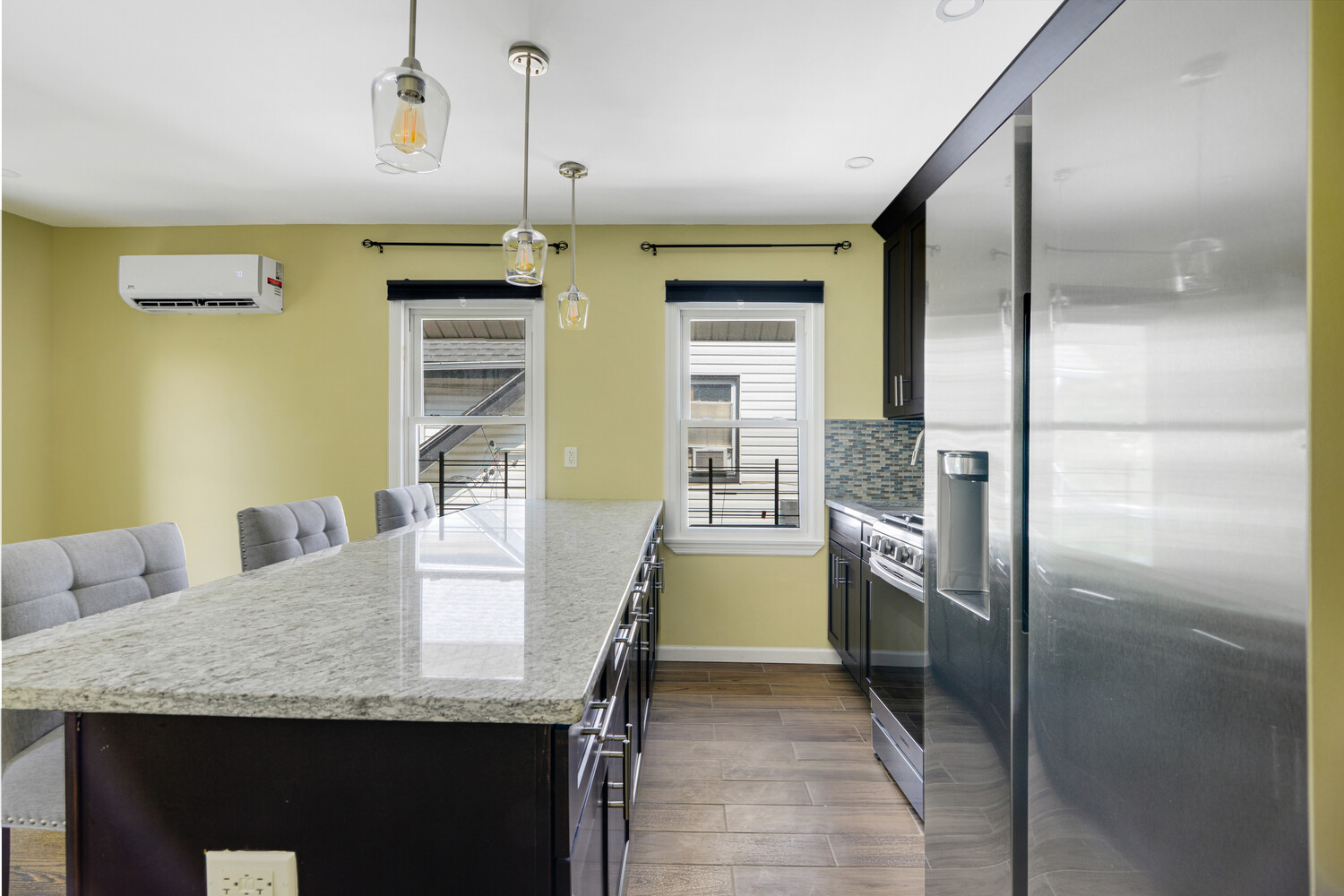 144-38 87th Avenue, Unit 2 Queens, NY 11435 - Photo 5 of 14 a kitchen with refrigerator and countertop