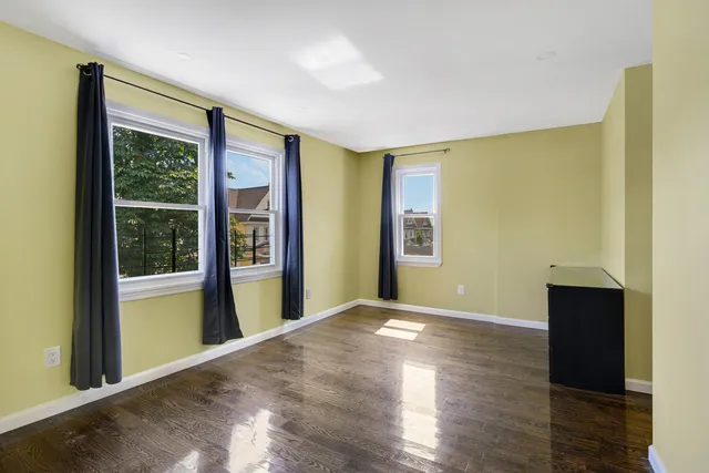 a view of an empty room with glass door