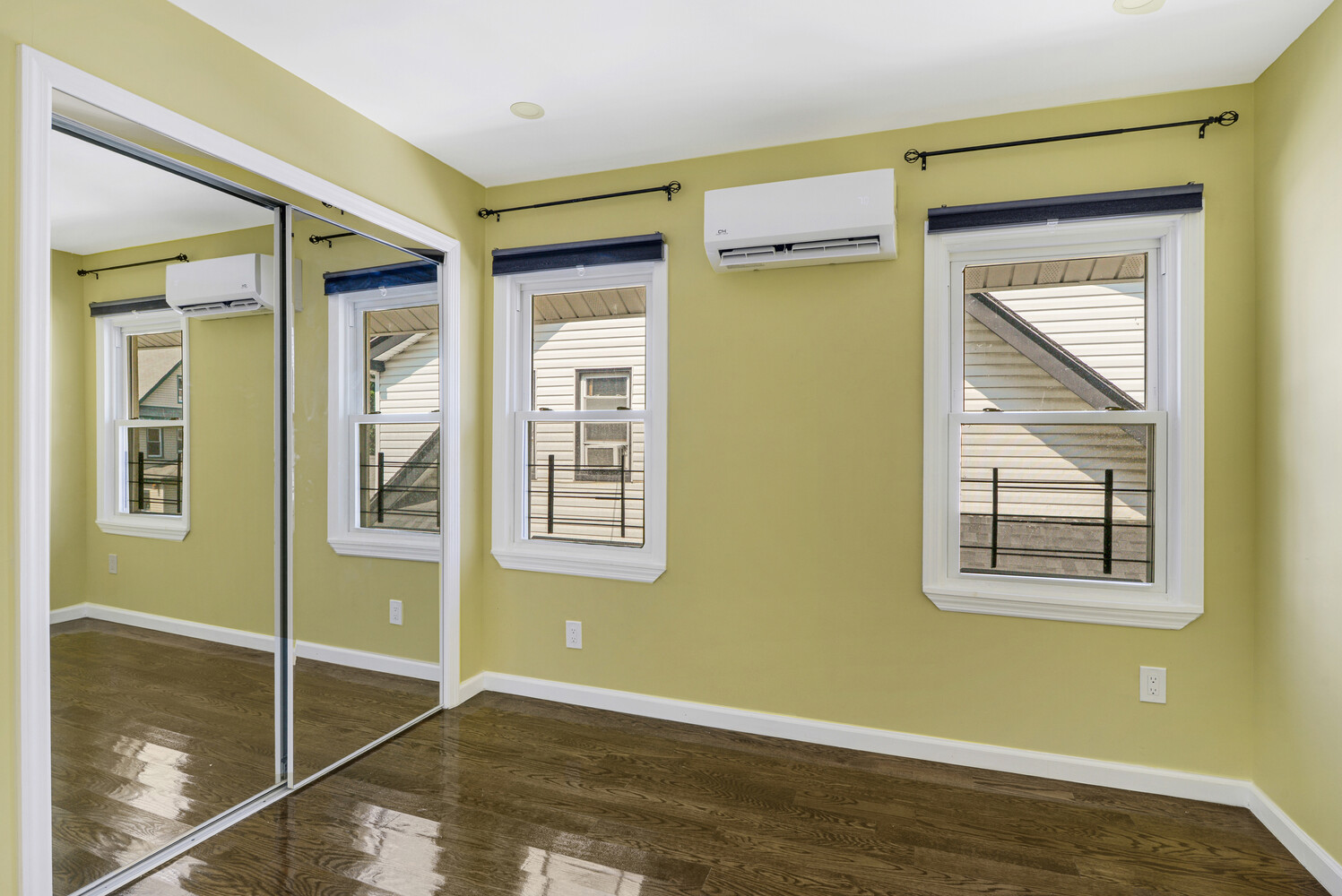 144-38 87th Avenue, Unit 2 Queens, NY 11435 - Photo 7 of 14 a view of an empty room with window and a bathroom