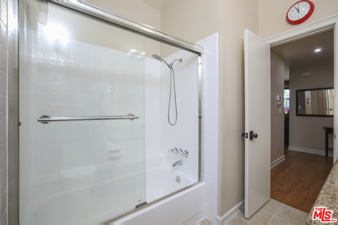 8110 Manitoba Street, Unit 104 Playa del Rey, CA 90293 - Photo 11 of 17 a bathroom with a glass shower door