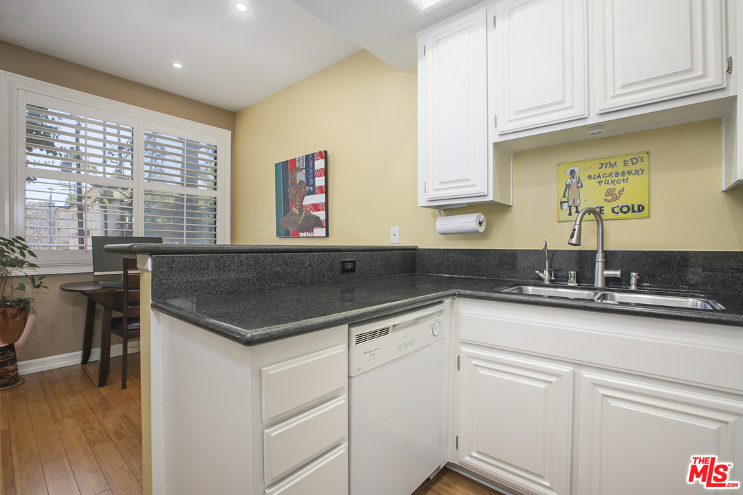 8110 Manitoba Street, Unit 104 Playa del Rey, CA 90293 - Photo 6 of 17 a kitchen with a sink and cabinets