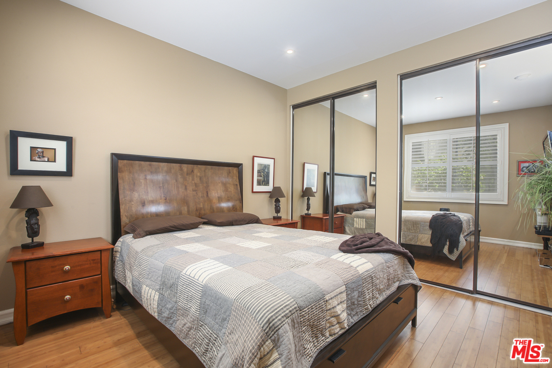 8110 Manitoba Street, Unit 104 Playa del Rey, CA 90293 - Photo 8 of 17 a bedroom with a bed and a large window