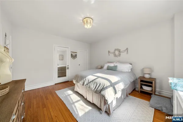 a bedroom with bed and a window