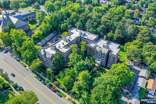 an aerial view of a house with a garden