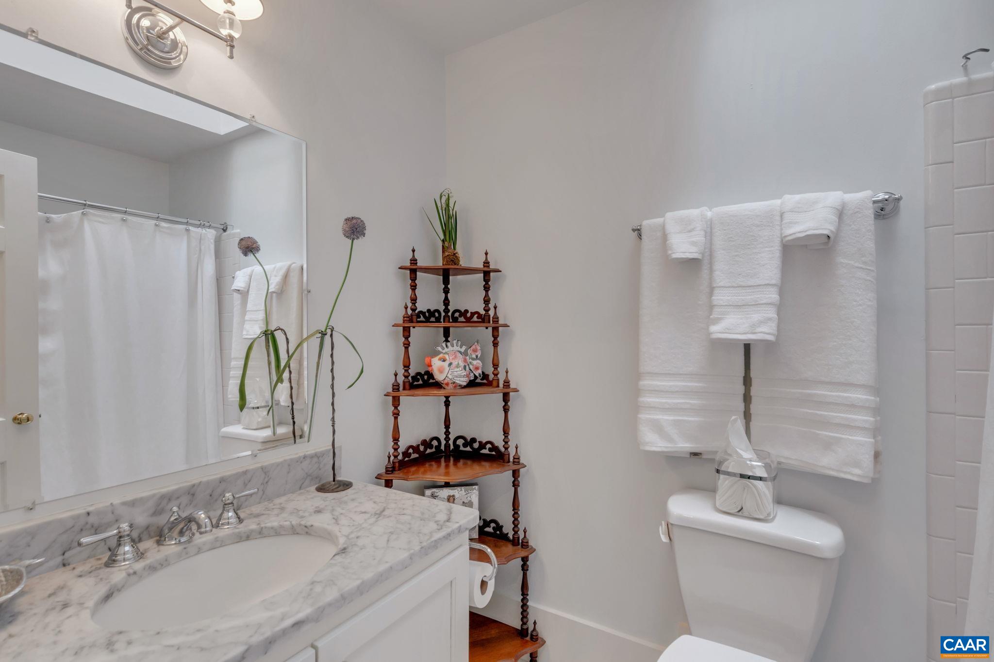 1815 Winston Road Charlottesville, VA 22903 - Photo 34 of 65 a bathroom with a sink and a mirror