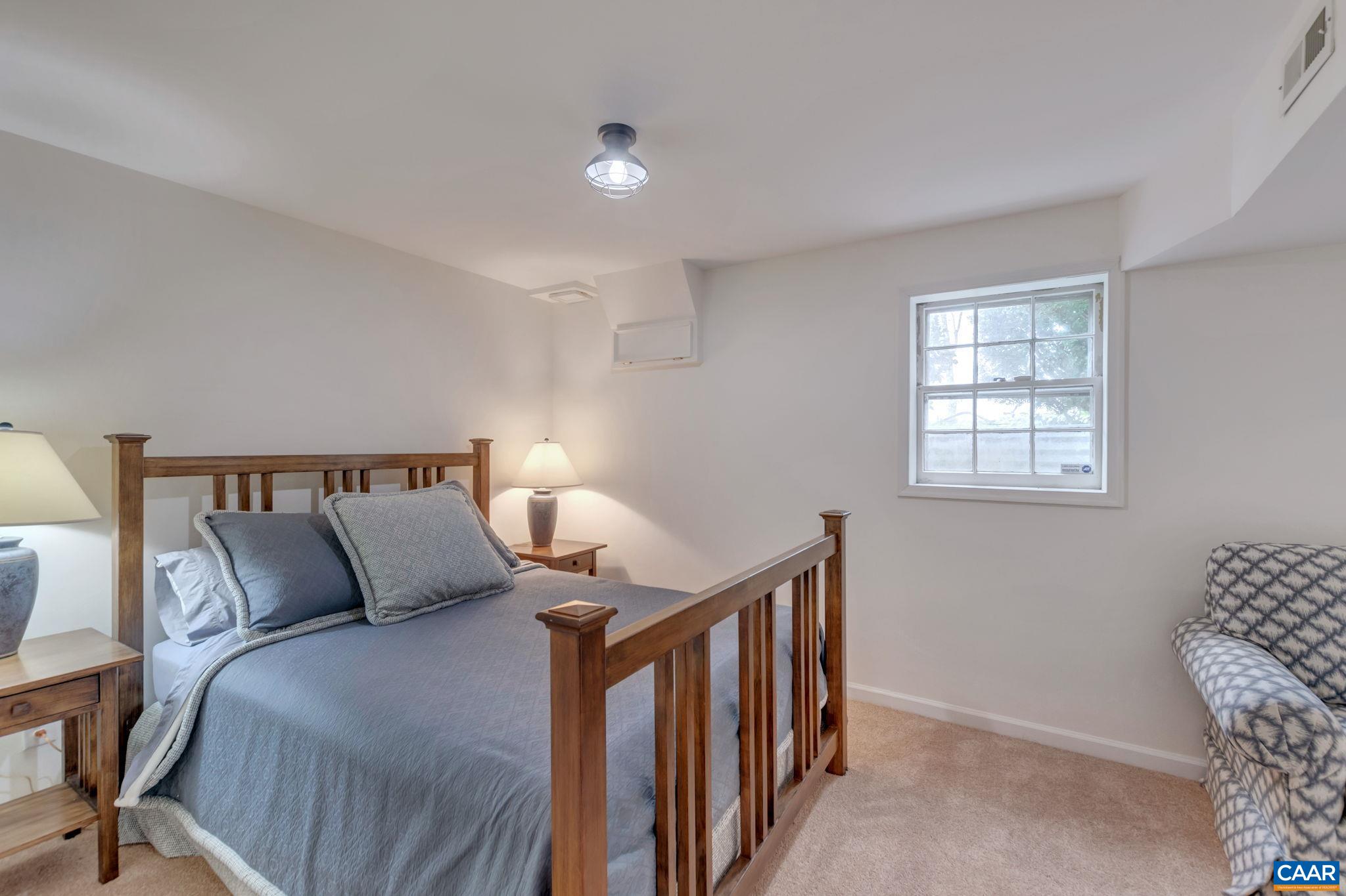 1815 Winston Road Charlottesville, VA 22903 - Photo 43 of 65 a bedroom with a bed and a window
