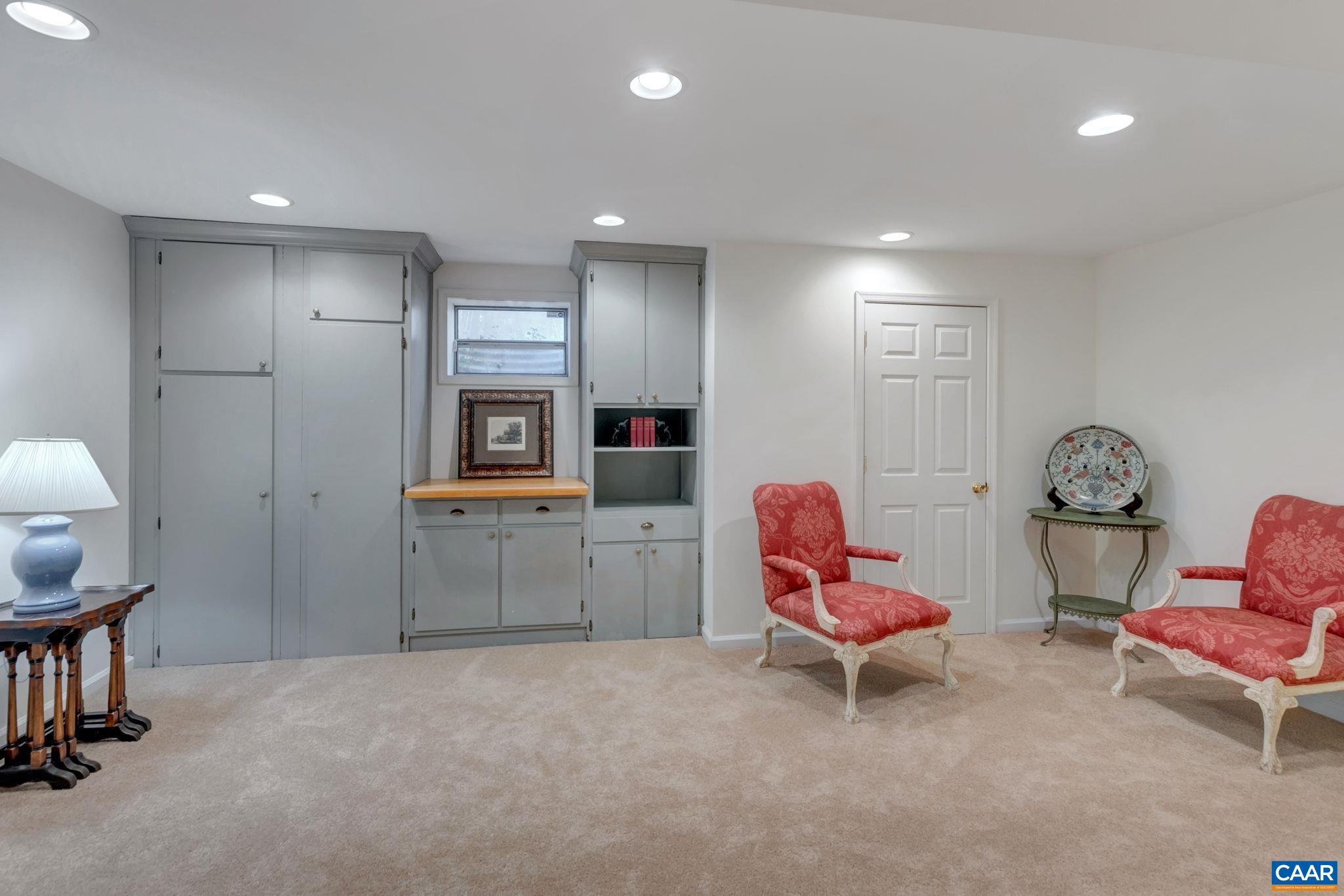 1815 Winston Road Charlottesville, VA 22903 - Photo 46 of 65 a living room with furniture and a wooden floor