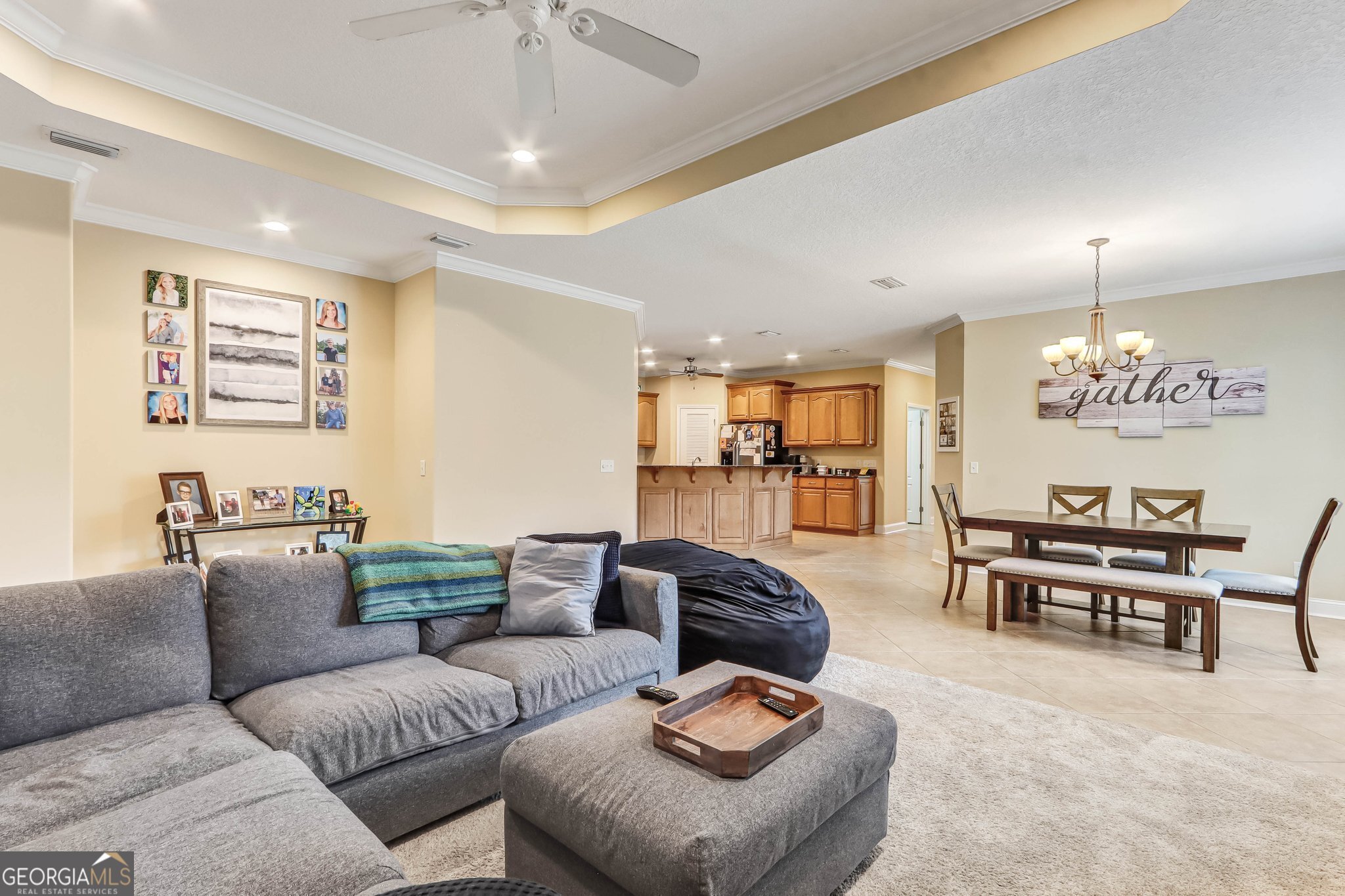 601 Eagle Boulevard Kingsland, GA 31548 - Photo 17 of 41 a living room with furniture kitchen view and a chandelier