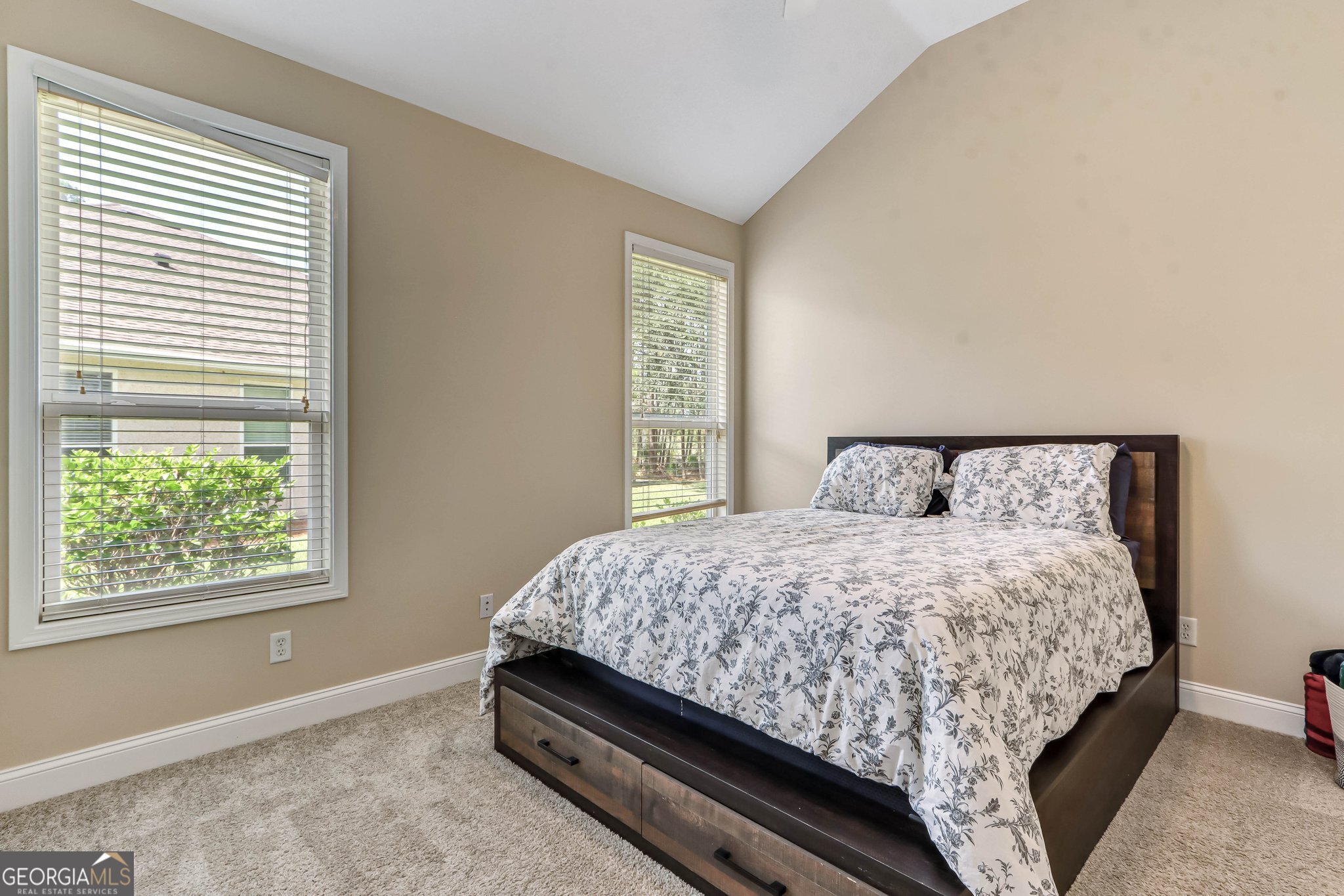 601 Eagle Boulevard Kingsland, GA 31548 - Photo 25 of 41 a bed sitting in a bedroom next to a window