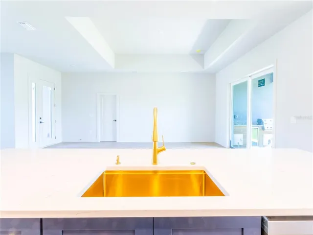 a spacious bathroom with a sink a mirror and shower