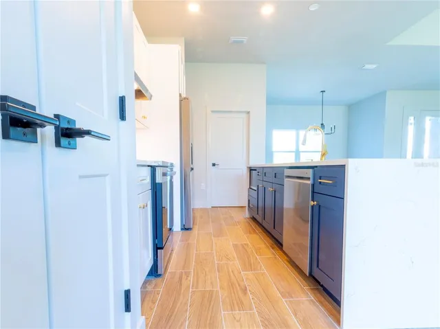 a view of a kitchen with furniture and a kitchen