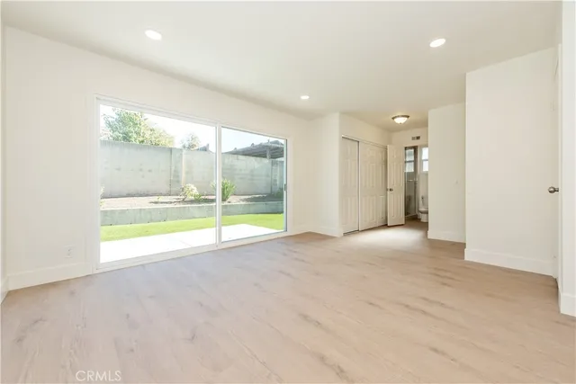 a view of an empty room with a sliding door