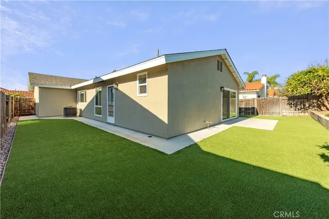 a view of a back yard of the house