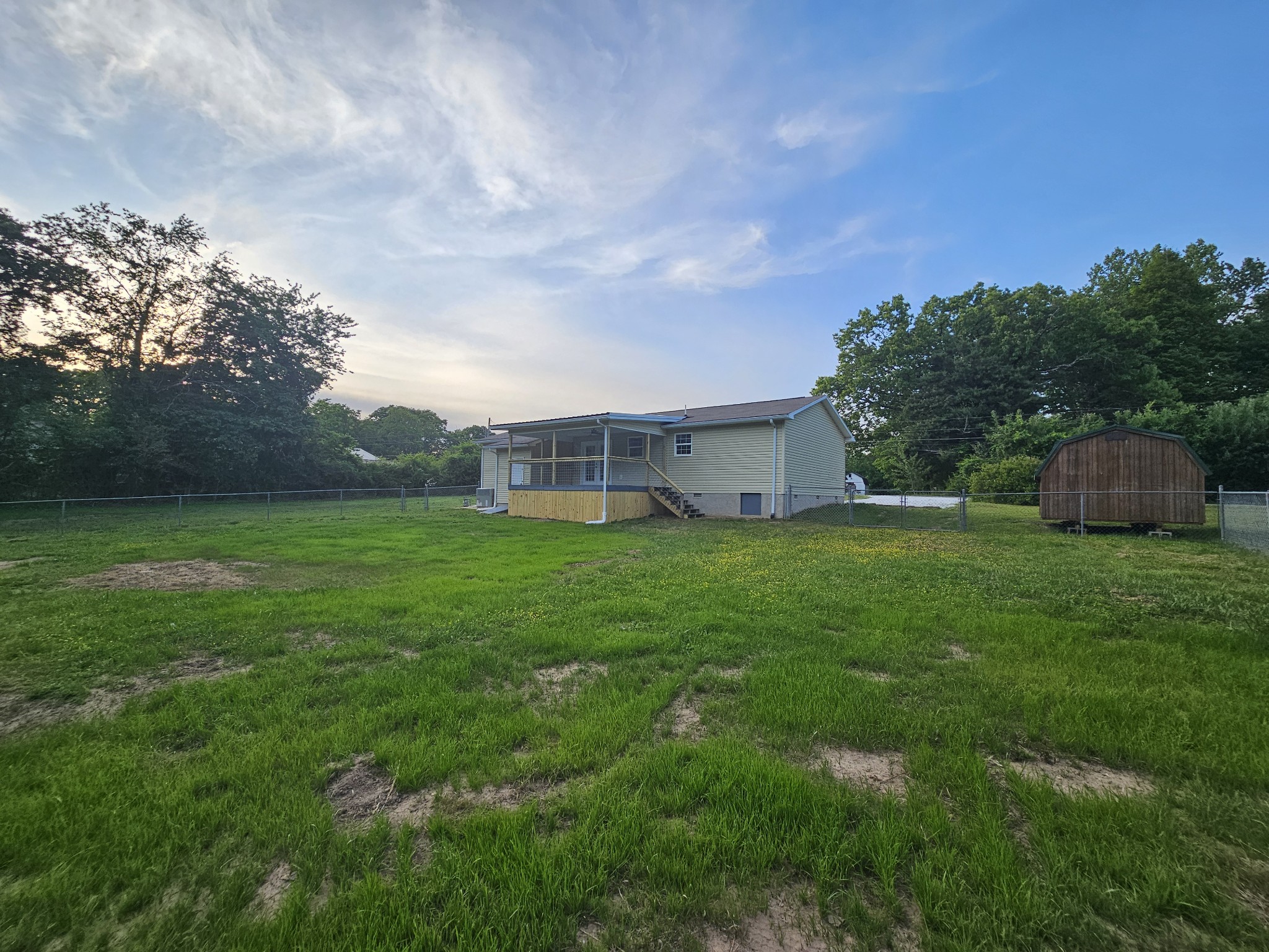 362 Forest Point Road Monteagle, TN 37356 - Photo 16 of 42 a view of a house with a back yard