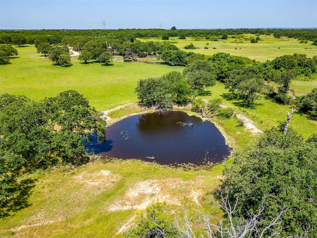210 Trails End Poolville, TX 76487 - Photo 8 of 25 a view of a lake with a yard