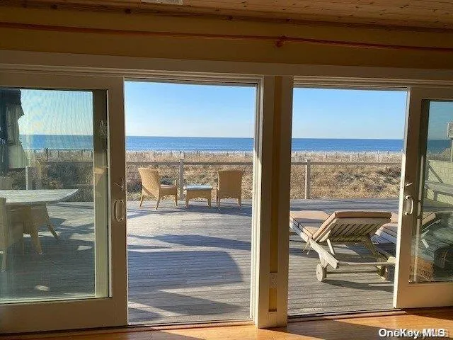 a view of a glass door and the balcony