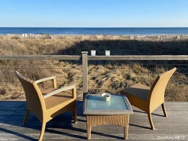 a view of a chairs and table on the deck
