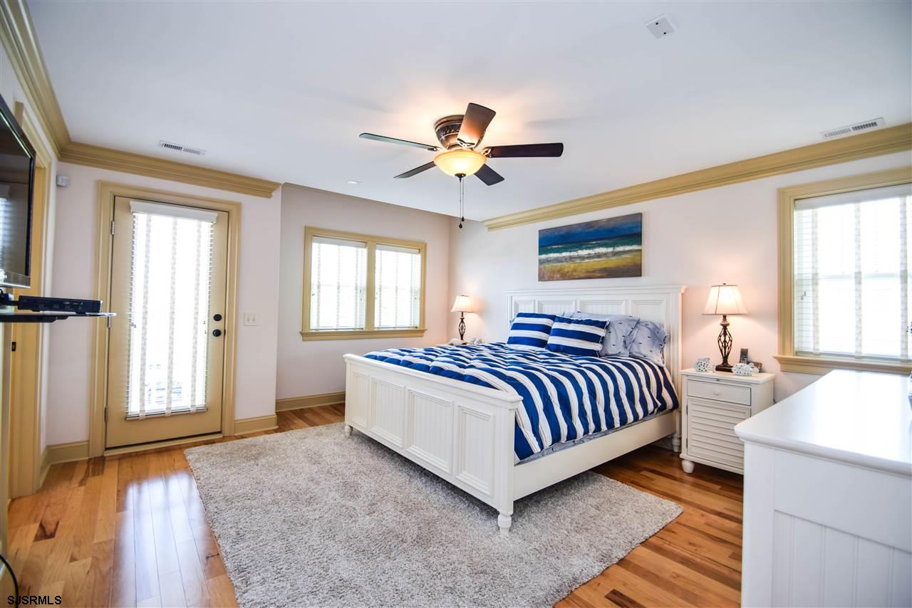 11 South 31st Avenue Longport, NJ 08403 - Photo 15 of 25 a spacious bedroom with a bed and window