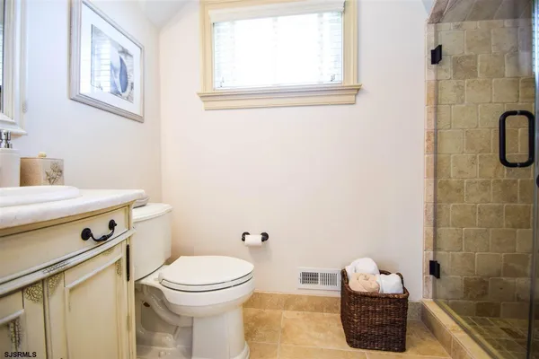 a bathroom with a toilet and a sink