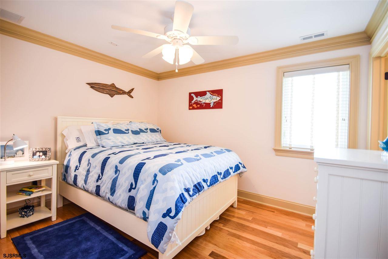 11 South 31st Avenue Longport, NJ 08403 - Photo 19 of 25 a bedroom with a bed and a window