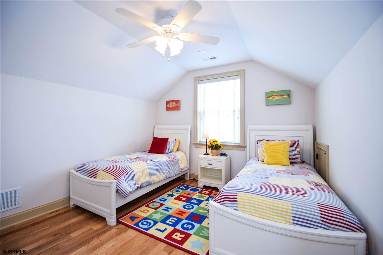 11 South 31st Avenue Longport, NJ 08403 - Photo 22 of 25 a bedroom with 2 bed and a window
