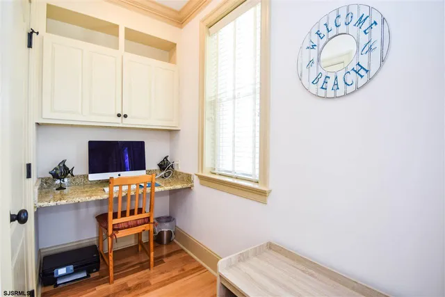 a workspace with furniture and window