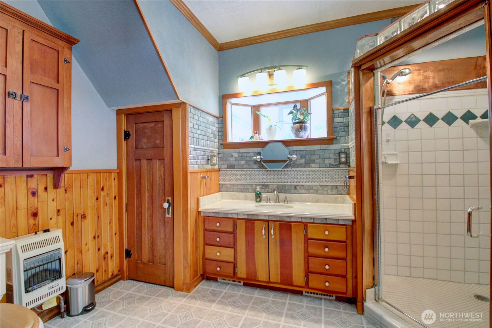 2909 Overpass Road Bow, WA 98232 - Photo 17 of 40 a bathroom with a sink a mirror and a shower