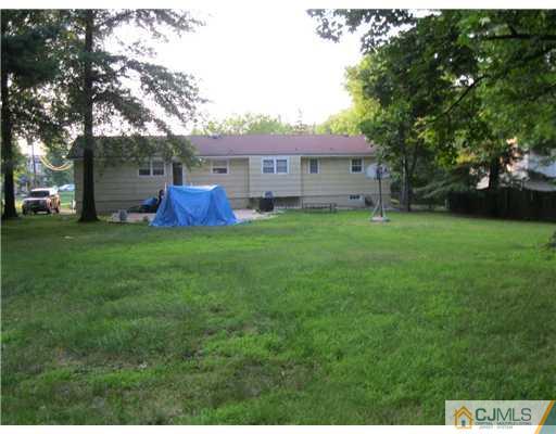 1101 New Dover Road Edison, NJ 08820 - Photo 4 of 7 a view of a house with a yard
