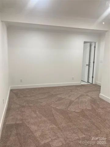 a bathroom with a granite countertop sink toilet mirror and bathtub