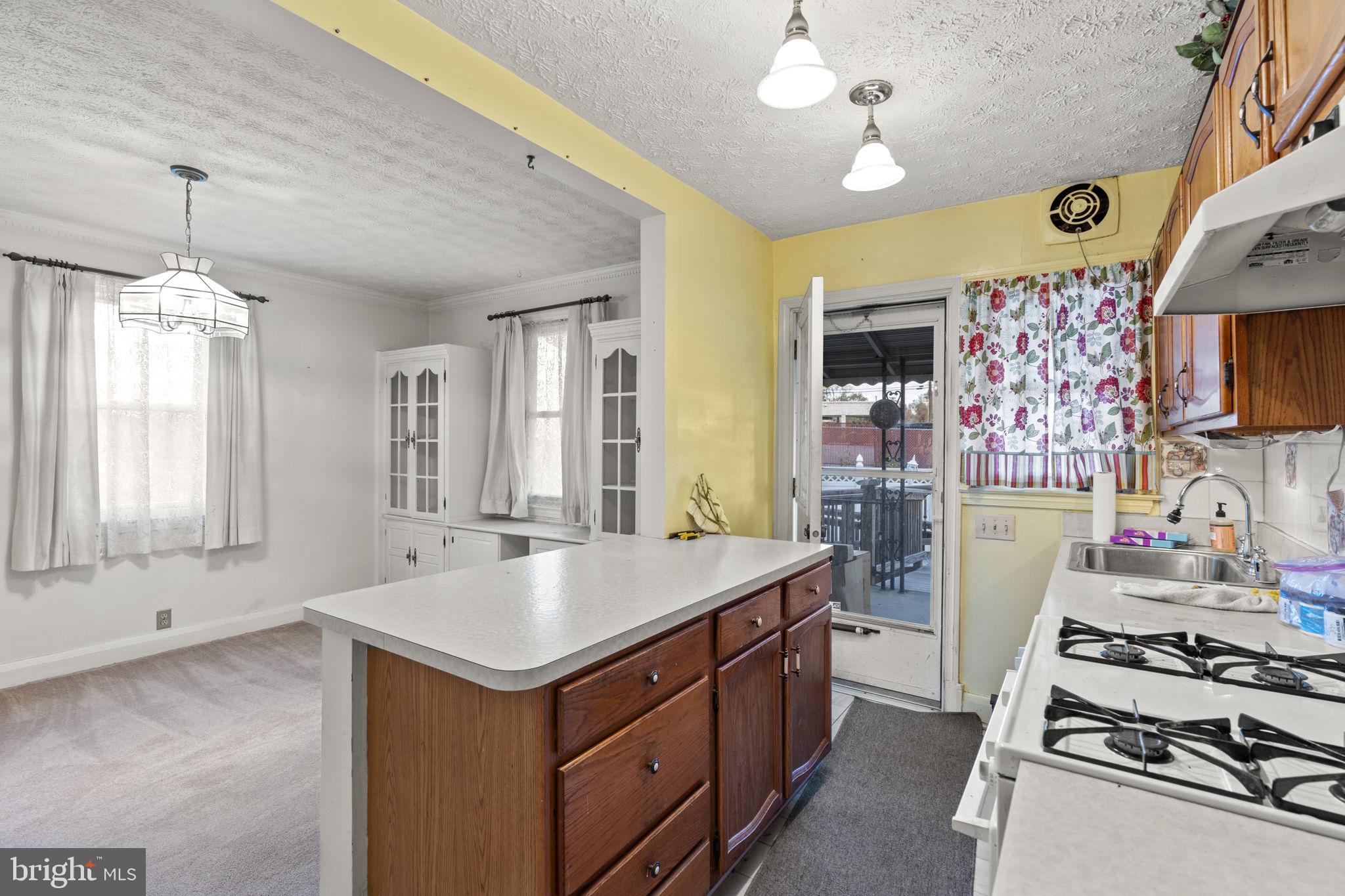 1870 Yakona Road Baltimore, MD 21234 - Photo 11 of 31 a kitchen with a stove and a sink