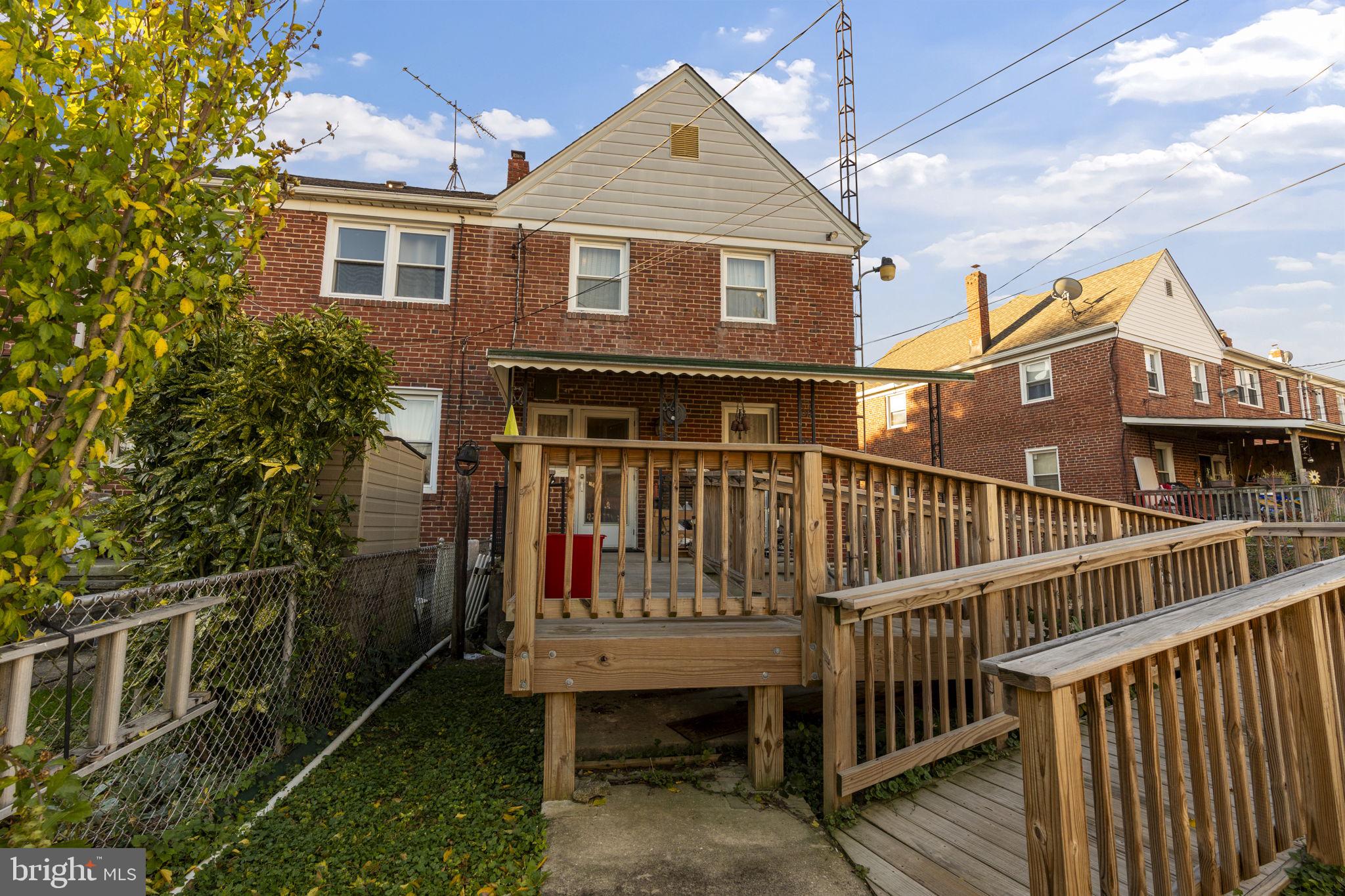 1870 Yakona Road Baltimore, MD 21234 - Photo 16 of 31 a view of a house with wooden deck and a yard