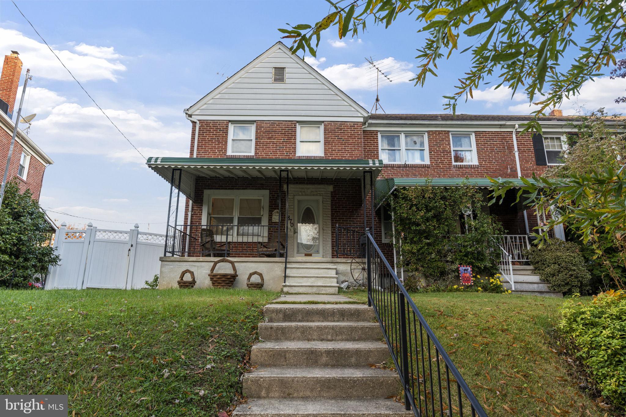 1870 Yakona Road Baltimore, MD 21234 - Photo 2 of 31 a front view of a house with a yard and potted plants