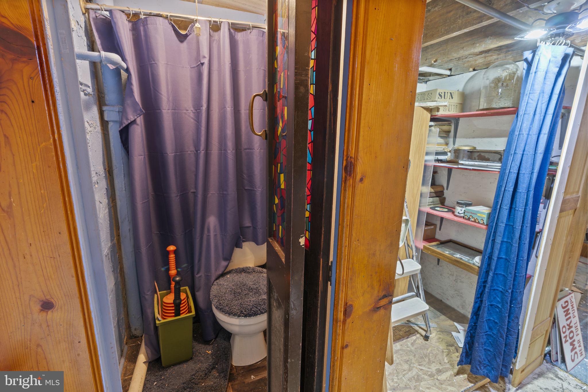 1870 Yakona Road Baltimore, MD 21234 - Photo 28 of 31 a bathroom with a sink and a shower curtain