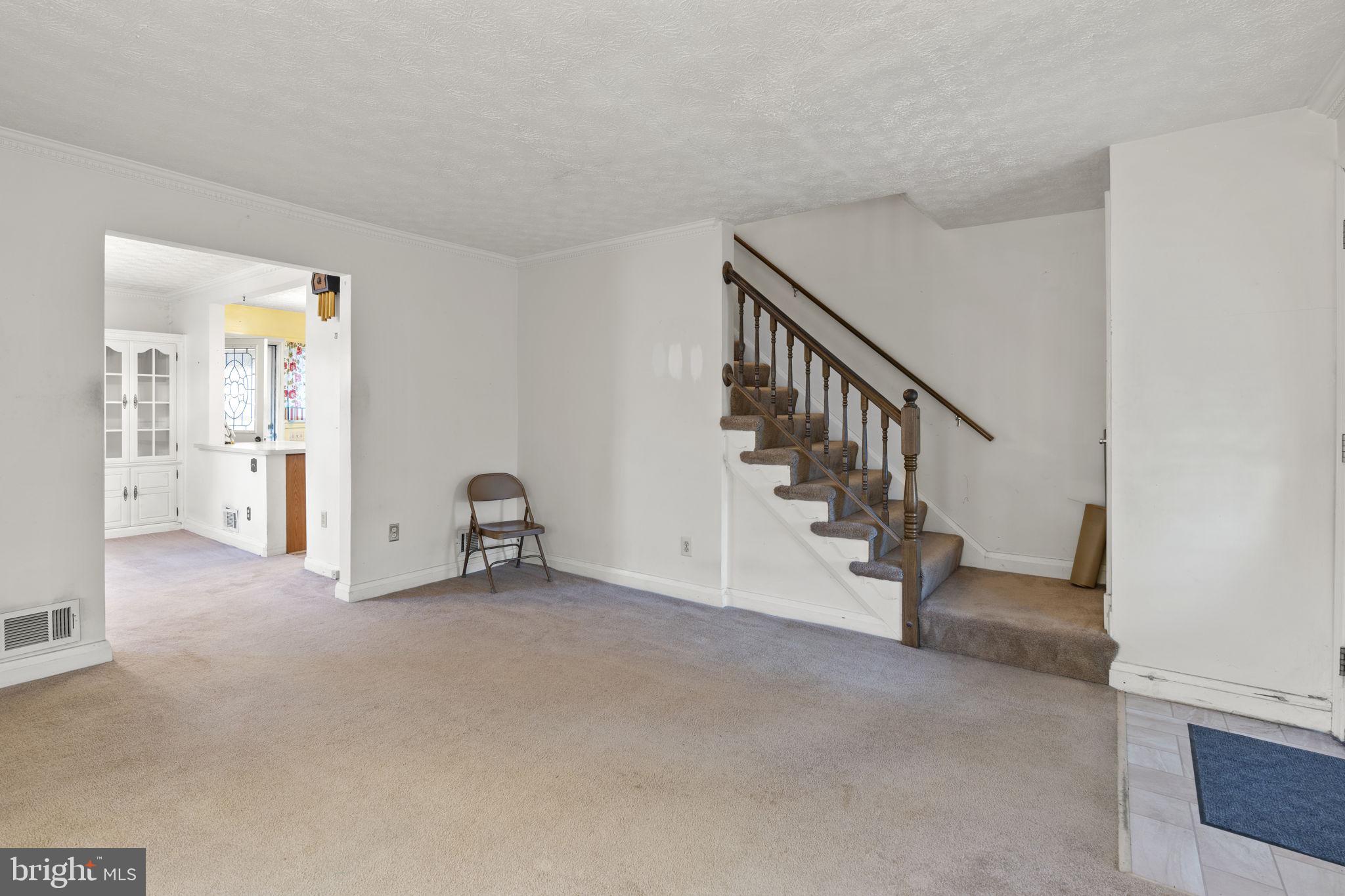 1870 Yakona Road Baltimore, MD 21234 - Photo 6 of 31 a view of an empty room with stairs and windows