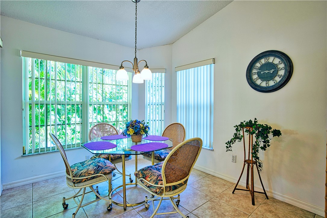 173 Easy Street Sebastian, FL 32958 - Photo 11 of 35 a view of a dining room with furniture window and outside view