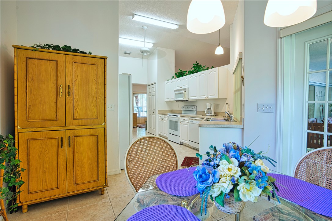 173 Easy Street Sebastian, FL 32958 - Photo 12 of 35 a view of a kitchen and dining area