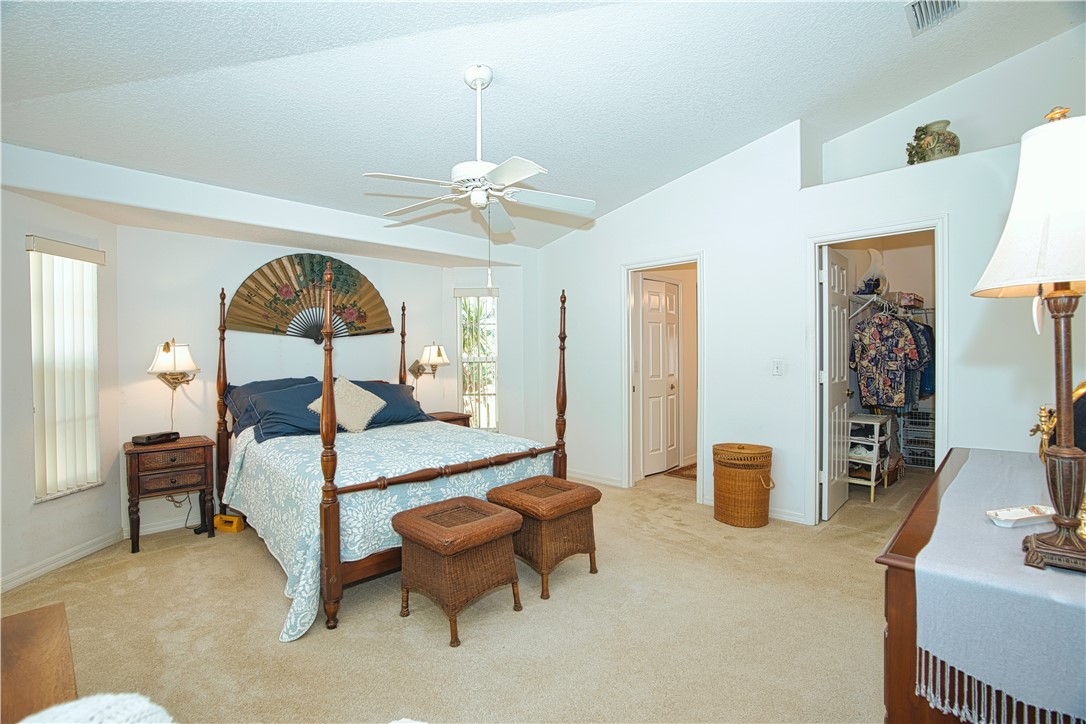 173 Easy Street Sebastian, FL 32958 - Photo 15 of 35 a bedroom with a bed wooden floor and window