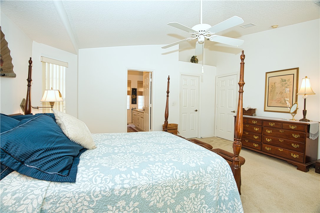 173 Easy Street Sebastian, FL 32958 - Photo 18 of 35 a bedroom with a bed and a dresser