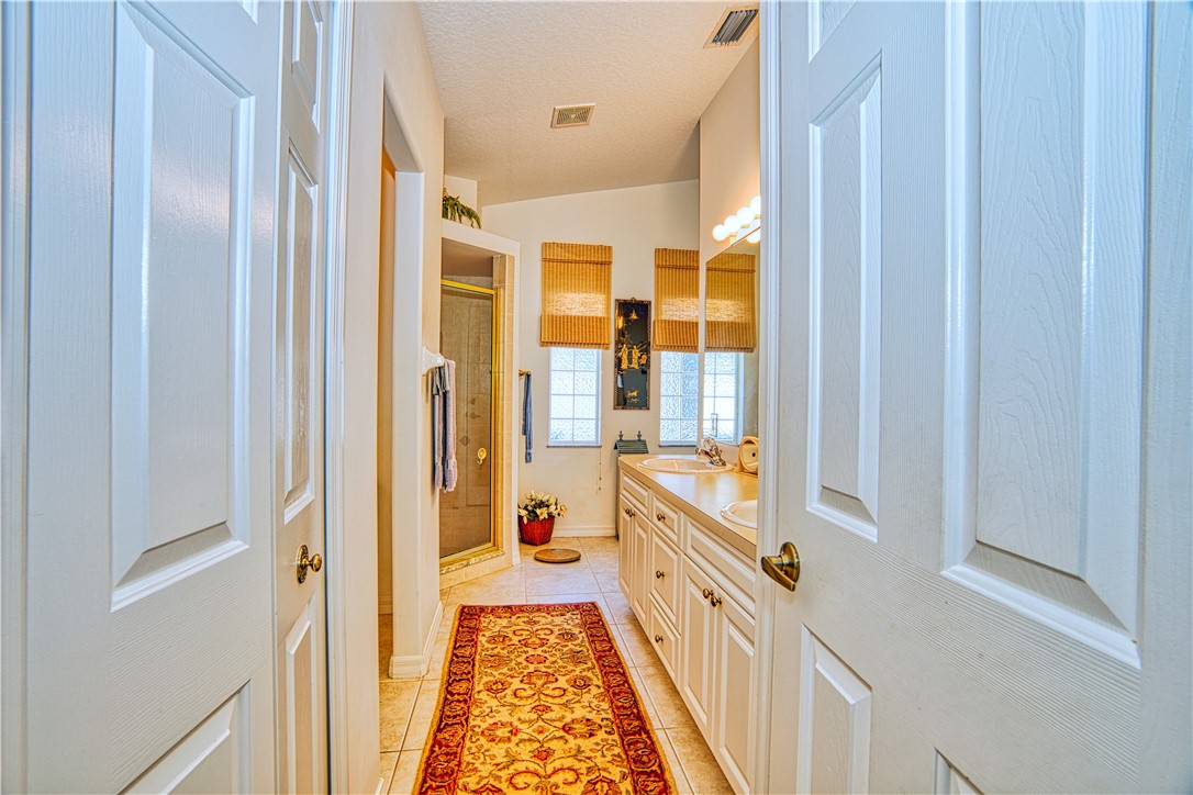 173 Easy Street Sebastian, FL 32958 - Photo 19 of 35 a bathroom with a tub and a view of a bathroom