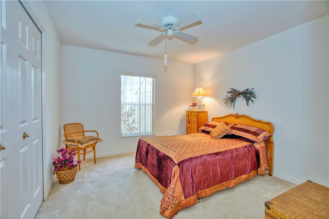 173 Easy Street Sebastian, FL 32958 - Photo 22 of 35 a bedroom with bed and window